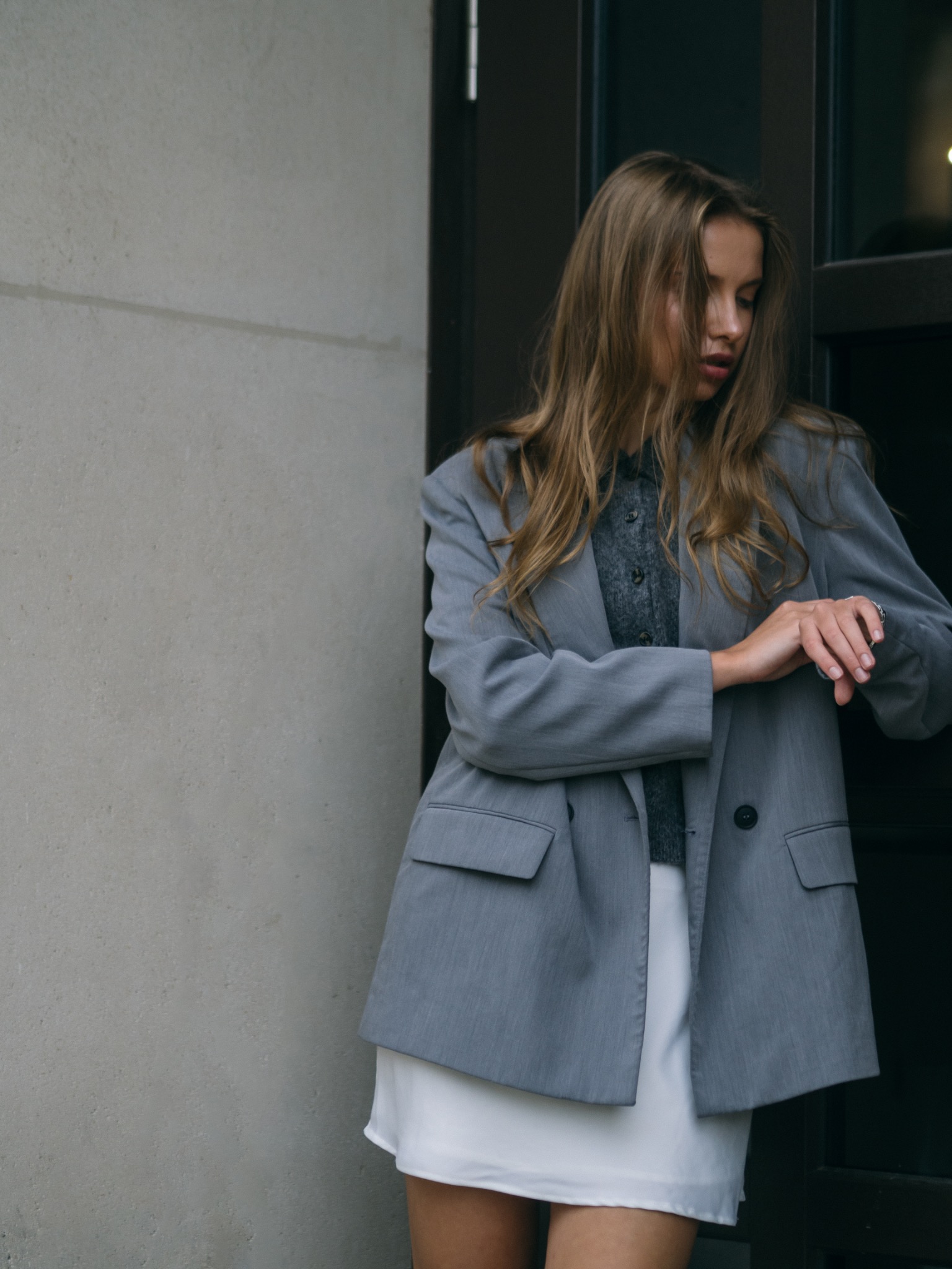 Fashion portrait in an oversized grey blazer